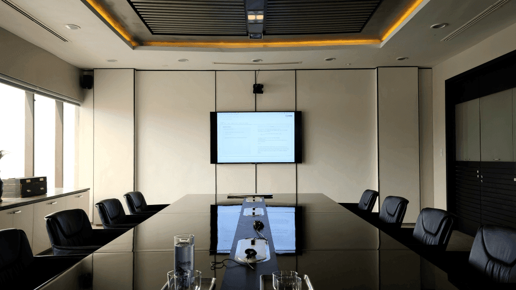 State-of-the-Art Corporate Boardroom — Mirror-Gloss Jet Black Conference Table & Seamless Cladding